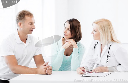 Image of doctor with patients in cabinet