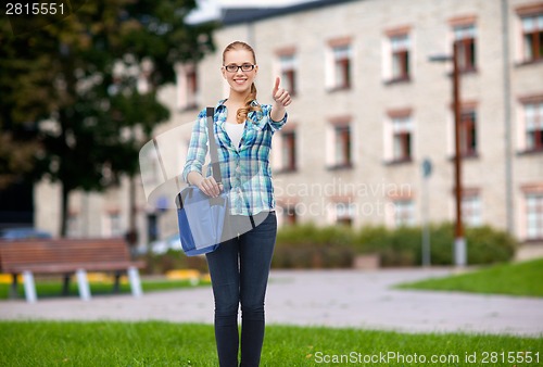 Image of student with laptop bag showing thumbs up
