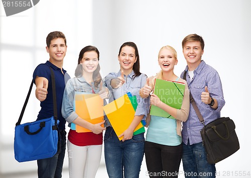 Image of group of smiling students showing thumbs up