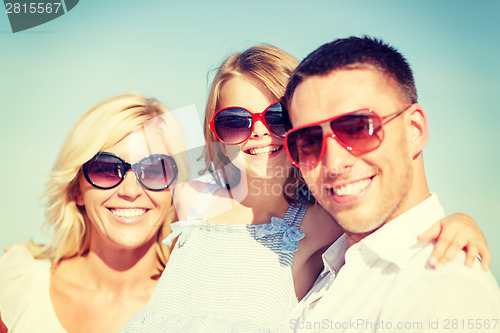 Image of happy family with blue sky