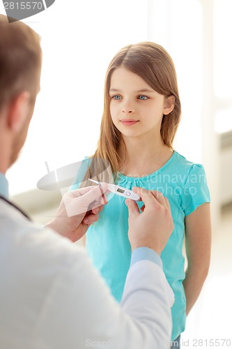 Image of male doctor with child measuring temperature