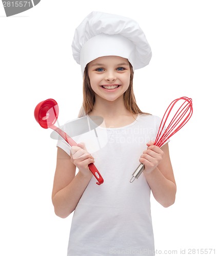 Image of smiling girl in cook hat with ladle and whisk