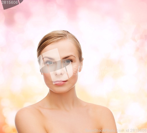 Image of face and shoulders of young woman