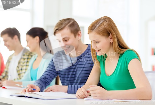 Image of students with textbooks and books at school