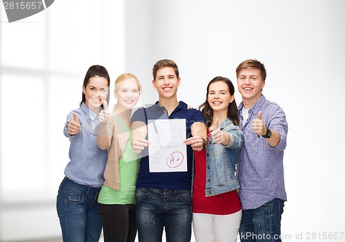 Image of group of students showing test and thumbs up