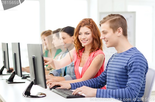 Image of female student with classmates in computer class