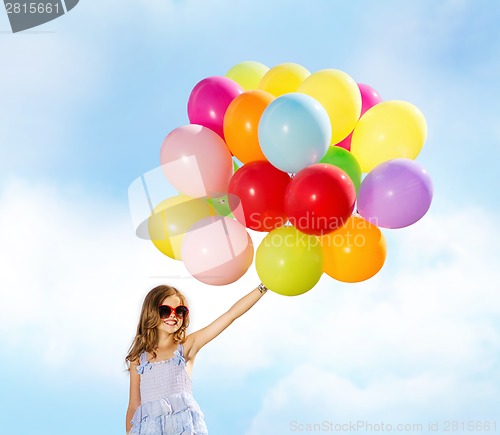 Image of happy girl with colorful balloons