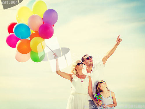 Image of family with colorful balloons