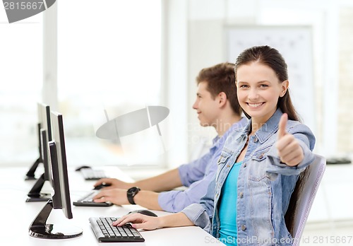 Image of two smiling students in computer class