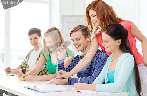 Image of students with textbooks and books at school