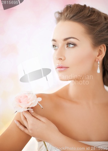 Image of young woman with rose flower