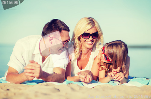 Image of happy family on the beach