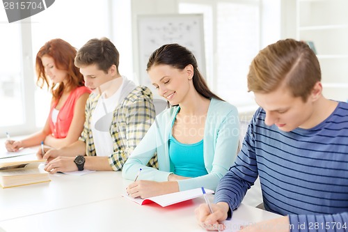 Image of students with textbooks and books at school