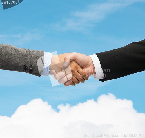 Image of businessman and businesswoman shaking hands