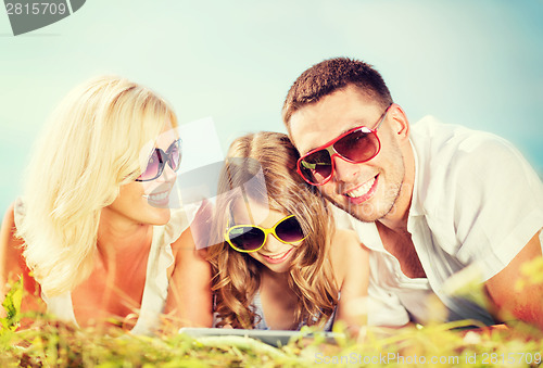 Image of happy family with tablet pc