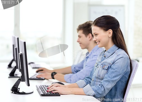 Image of two smiling students in computer class