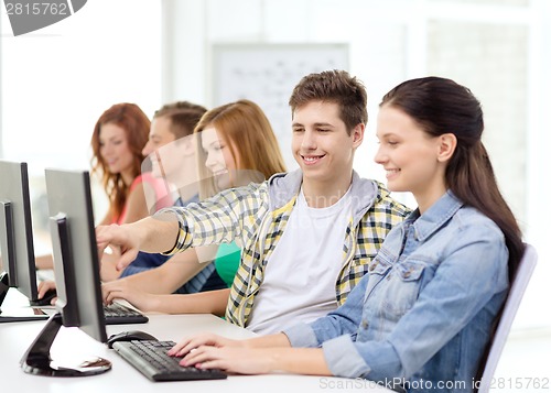 Image of female student with classmates in computer class