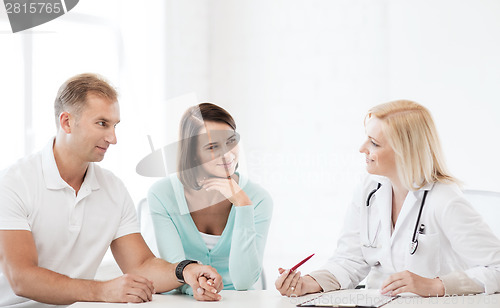 Image of doctor with patients in cabinet