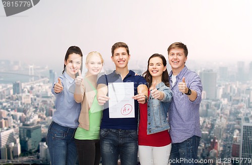 Image of group of students showing test and thumbs up