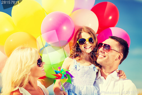 Image of family with colorful balloons