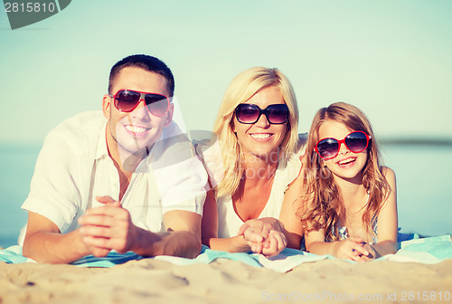 Image of happy family on the beach