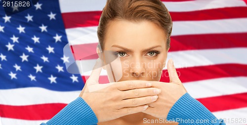 Image of woman with hands over mouth