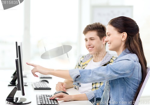 Image of two smiling students in computer class