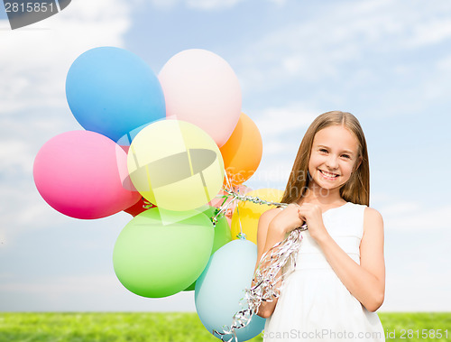 Image of happy girl with colorful balloons