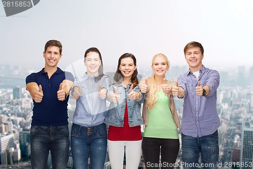 Image of group of smiling students showing thumbs up