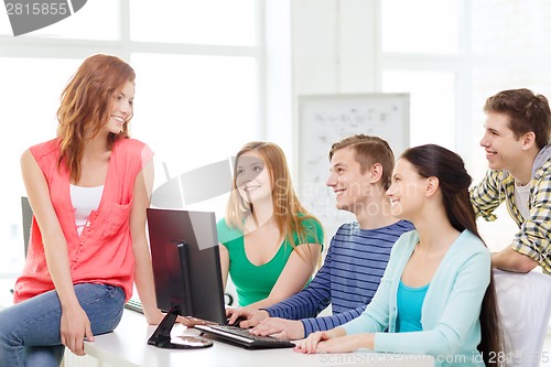 Image of group of smiling students having discussion