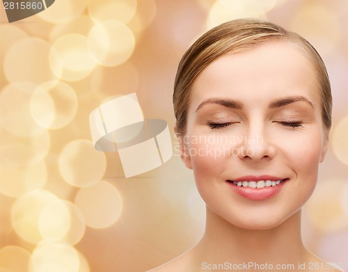 Image of face of beautiful woman with closed eyes