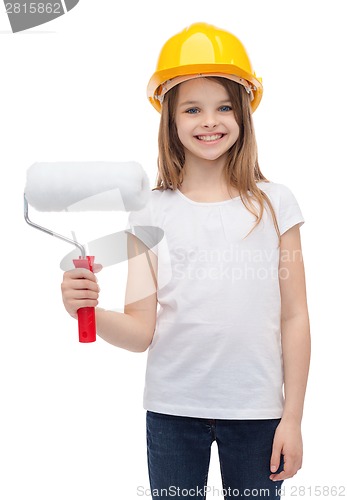 Image of smiling little girl in helmet with paint roller