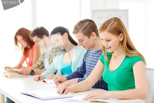 Image of students with textbooks and books at school