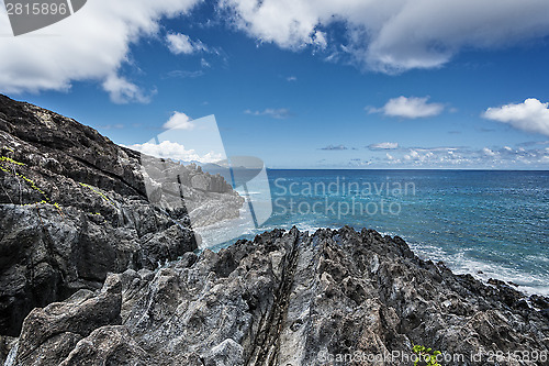 Image of rocky shoreline of tropical volcanic island