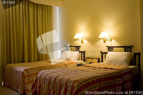 Image of Two single bed in a hotel suite room

