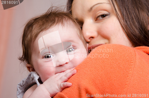 Image of Six-month baby girl on hands happy mom