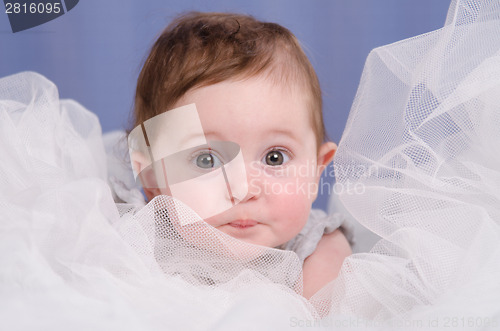 Image of Six-month baby girl sitting in an air fabric