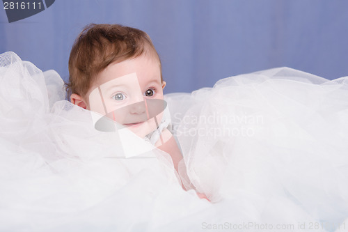 Image of Portrait of a girl lying in the six-month tissue