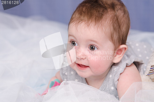 Image of Six-month baby girl in crib