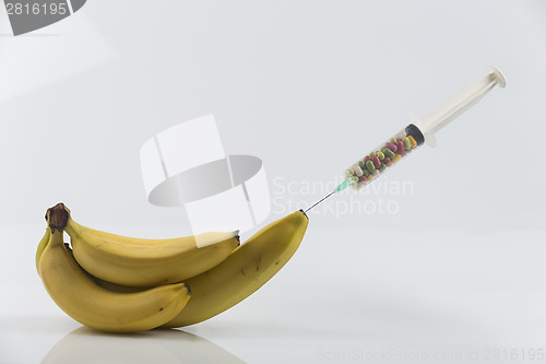 Image of Banana and syringe with pills