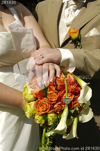 Image of Wedding hands and flowers