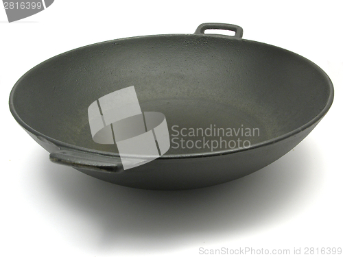 Image of A big black wok for cooking on white
