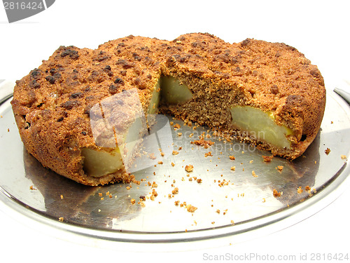 Image of Sliced wholemeal  pear cake on a cake plate