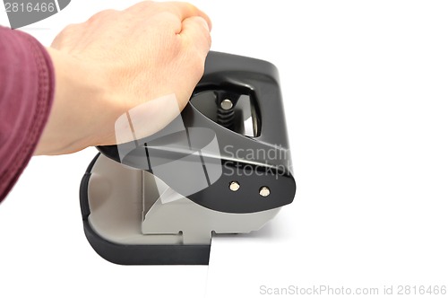 Image of Hand with hole punsh