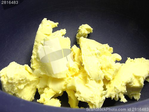 Image of Pieces of margarine in a blue bowl