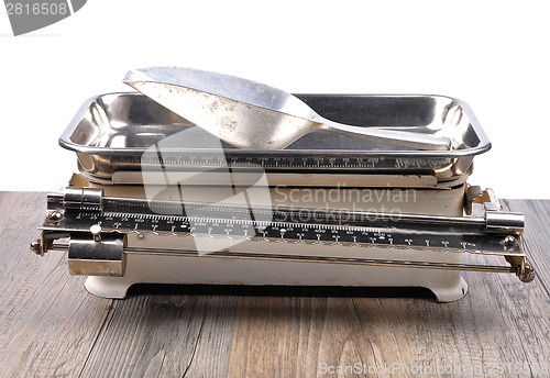 Image of Old kitchen scales on white