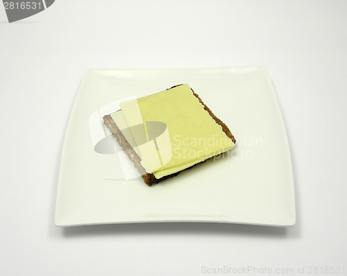 Image of Wholemeal bread with two slices of cheese on a plate