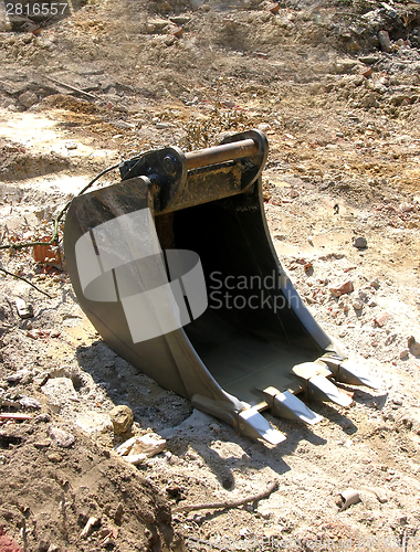 Image of Single digger shovel on a site