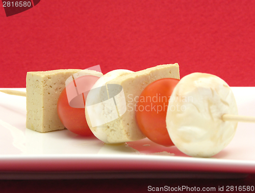 Image of Vegetable spit with bean curd and rice on white plate