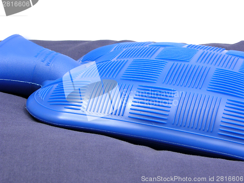 Image of Blue hot-water bag on a blue pillow